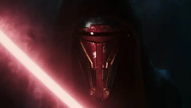 A Sith Lord holds up a red light saber. 